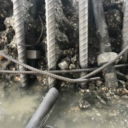 Exposed rebar, undamaged with the faulty bolts in view. The bolts were cut as requested.