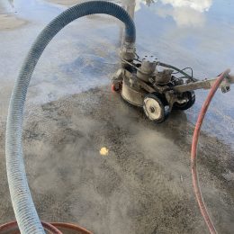 Deck machine with vacuum recovery performing surface preparation.